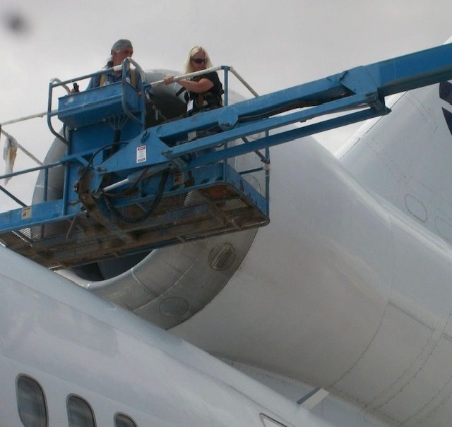 Annie working on aircraft — aviation compliance